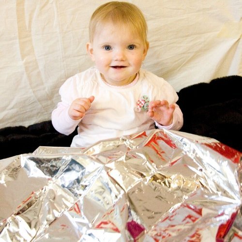 Space Blanket, The space blanket is the perfect special needs sensory resource and has so many sensory play benefits. The space blanket foil provides a rewarding crinkly noise which children love to experience by touch and sound making this a tactile dream which is both comforting and relaxing. Take the space blanket and reflect light onto it and watch as the Foil blanket becomes a beacon of light reflecting across the space blanket. The space blanket is a reassuring snug comforter to many children with spe