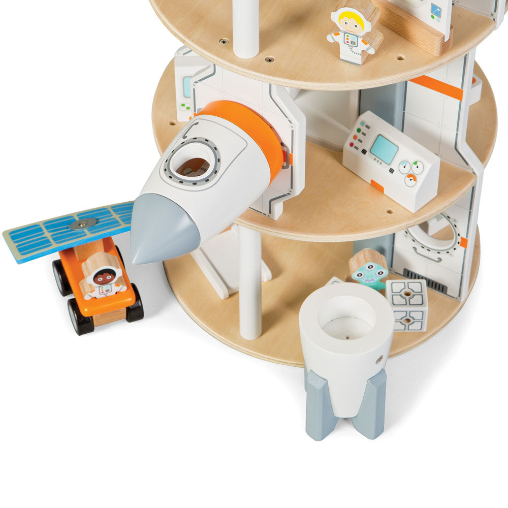 Space Station, Blast off into a universe of wonder with this 22 piece Space Station playset from Tidlo! Send your astronaut into space in the rocket, and as you are nearing your approach jettison the rocket's module and dock with the station's airlocks to climb aboard. Explore the station using the working lift, observe the stars with the telescope and computer equipment, visit the hydroponic garden and get some exercise on the treadmill. Use the space crane to move the storage cubes and samples about the s
