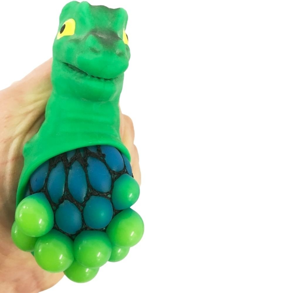 Squeezy Mesh Dinosaur, When squeezed, the mesh ball inside the dinosaur squishes and moves, creating a unique and satisfying tactile experience. The Squeezy Mesh Dinosaur has a rubberized outer shell is soft and pliable, making it easy to grip and squeeze. This makes it an excellent sensory tool for children and adults who need a calming effect when feeling anxious or stressed. Additionally, the bright and colorful design of the Squeezy Mesh Dinosaur is visually appealing and stimulating. Small and portable