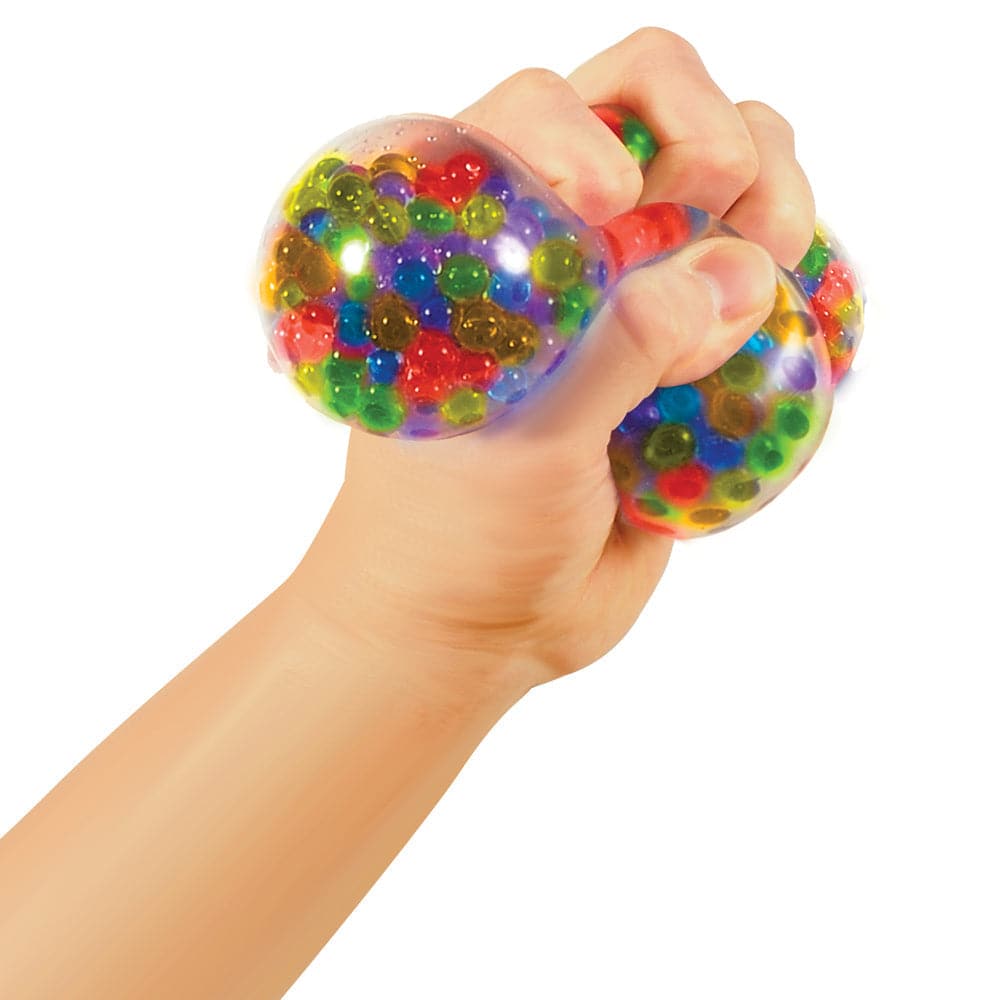 Squeezy Peezy Stress Ball, The Schylling's Squeezy Peezy stress ball is a vibrant and multifaceted stress-relief tool, perfect for children. It's filled with tiny stress bead balls, making it a fun, tactile experience and an excellent fidget toy for kids. Features of the Squeezy Peezy Stress Ball: Multicoloured Appearance: Comes in diverse and lively colors, making it attractive to kids. Stress Bead Balls: Filled with tiny stress beads offering a distinctive and enjoyable squeezing experience. Safety and Qu