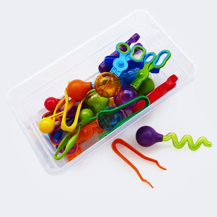 Squeezy Skills Kit, Introducing the Squeezy Skills Kit: Your Ultimate Toolkit for Fine Motor Development! Get ready for hours of tactile, sensory fun that both educates and entertains. The Squeezy Skills Kit is perfect for counting, sorting, and maths activities, all beautifully organised in a convenient, clear-lidded storage box. It's a fantastic resource designed to help children develop fine motor skills, and it also serves as a great addition to messy play activities. The Squeezy Skills Kit offers a sim