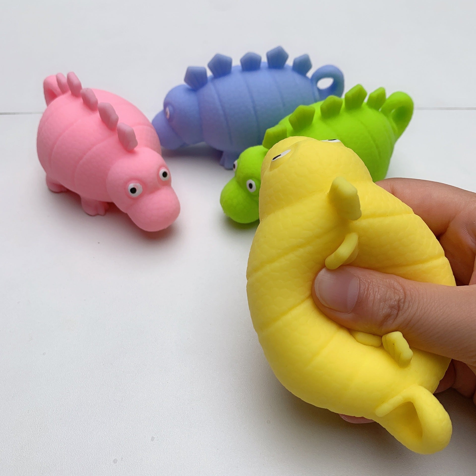 Squishy Dinosaur Toy, Introduce your senses to the delightful Squishy Dinosaur Toy—a multisensory experience that combines tactile pleasure, visual stimulation, and stress-relief, offering a wealth of benefits for users of all ages. 🦕 Squishy Dinosaur Toy Features: Squishy & Squeezy: Easy to squeeze, providing a satisfying sensory experience and stress relief. Tentacle Texture: Soft and tactile tentacles across its body make it pleasant to stroke and touch, enhancing tactile engagement. Light Up Feature: Eq