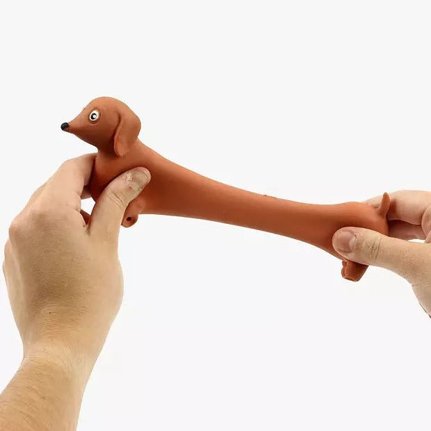 Stretchy Sausage Dog Fidget Toy, Sausage dogs are already adorable little stretchy bois. But thanks to this awesome gizmo you can really put them to the test. The stretch test, that is.Stretch makes things better. Your muscles, a limousine, and the truth... Maybe not the last one. But this Stretchy Sausage Dog Fidget Toy is specifically designed to be stretched and prodded and shaped and fiddled with until the cows come home. The Stretchy Sausage Dog Fidget Toy comes in four different colours - black, blond