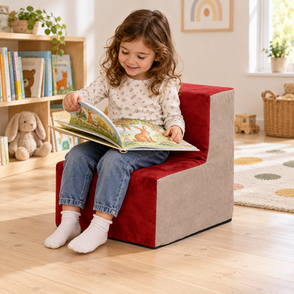 Child turning picture-book page on Wine suede chair