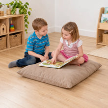 Suede Giant Cushion in use by a child during reading and play in an early years setting, lifestyle view 3