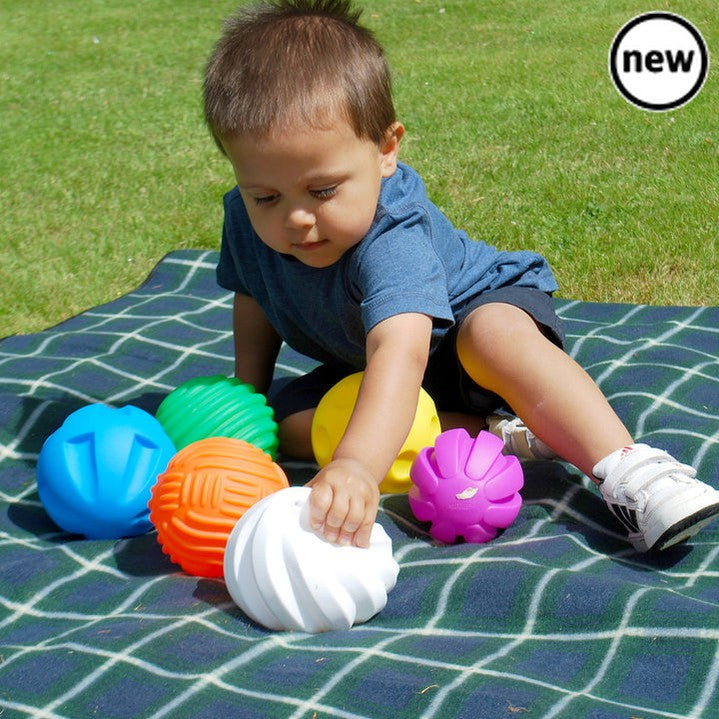 Tactile Ball Set, Immerse yourself in the world of sensory exploration with the incredible Tactile Ball Set from TickiT. This set of 6 large tactile balls is designed to captivate and engage children's senses, making it the perfect toy for tactile exploration.Each Tactile ball in the set has its own unique surface and texture, offering a multi-sensory experience that is a joy to behold. From smooth and bumpy to spiky and ridged, these balls provide a range of tactile sensations for children to explore.But t