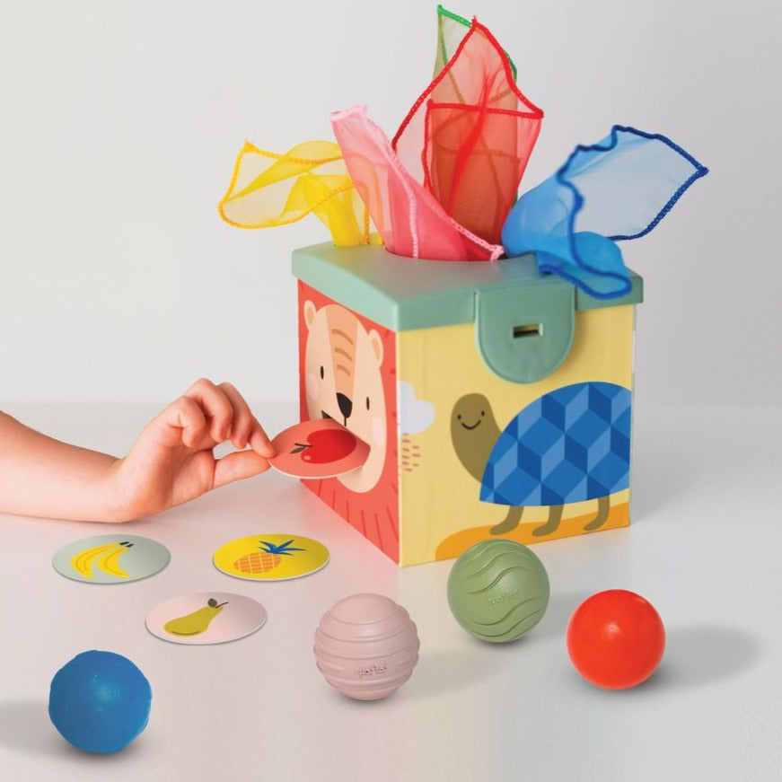 Taf Toys Magic Box, The Taf Toys Magic Box is the ideal toy that combines fun and learning for babies aged 6 months and above. The Magic Box is designed to help babies learn about emptying and filling containers. It encourages endless ideas for imaginative activities that promote exercise, movement actives, games, and family activities.The Magic Box comes with various components that inspire babies to play in different ways. For instance, the tissues inside the box are perfect for enhancing motor and sensor