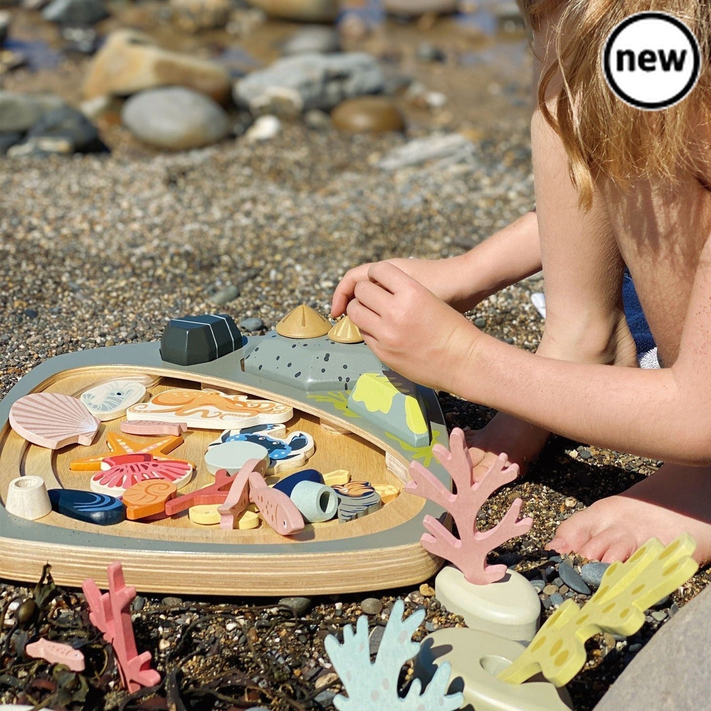 Tender Leaf Toys My Little Rock Pool, Step into a world of imaginative play with Tender Leaf Toys My Little Rock Pool. This beautifully designed Montessori toy is a plastic-free option that will transport your child to the seaside, rock pools, and sunny days at the beach.Crafted from beautifully painted wood, this toy offers endless opportunities for stacking, sorting, and creative play. Each wooden piece can be arranged and rearranged on the layered rock pool base, allowing your child to create their own u