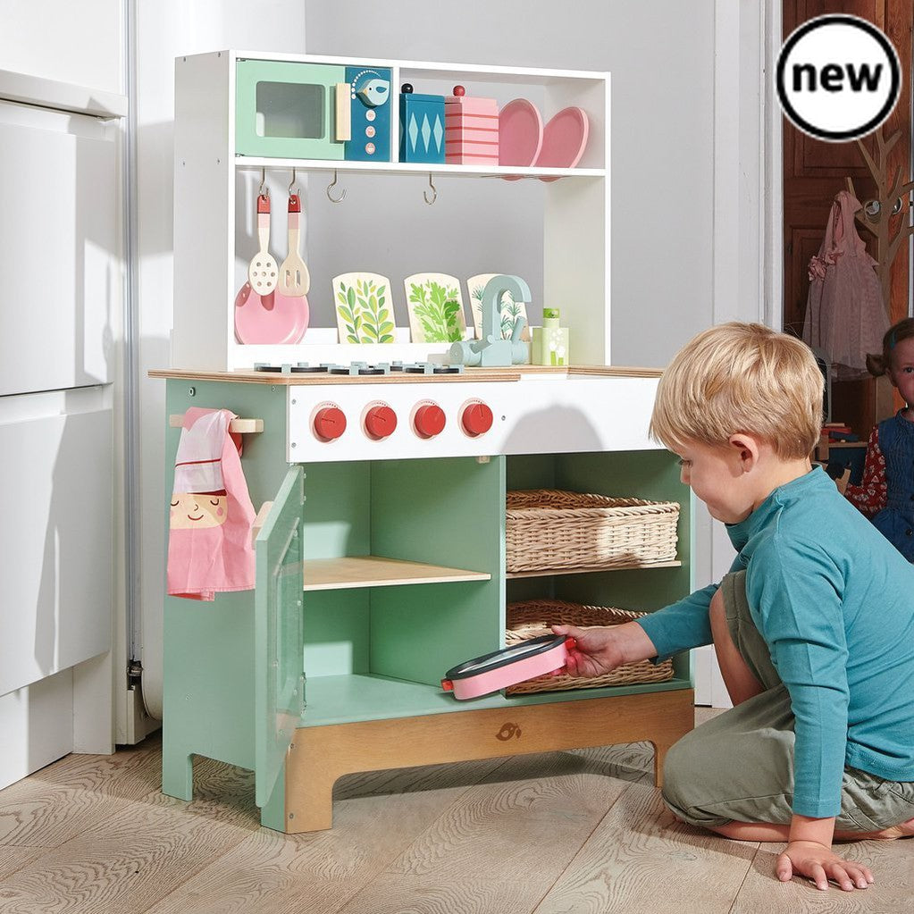 Tenderleaf Toys Wooden Kitchen Range, Wow, a Kitchen to entertain any budding Chef. This beautifully designed kitchen is the largest in the Tender Leaf range, complete with all the trimmings to provide hours of entertainment and fun. Two woven wicker basket drawers give this kitchen a really authentic and modern feel. The oven has an opening front door, a set of 4 cooker hobs and a microwave , what more could you want. Perfect for Role Play. Pretend play is an essential part of a child's development as chil