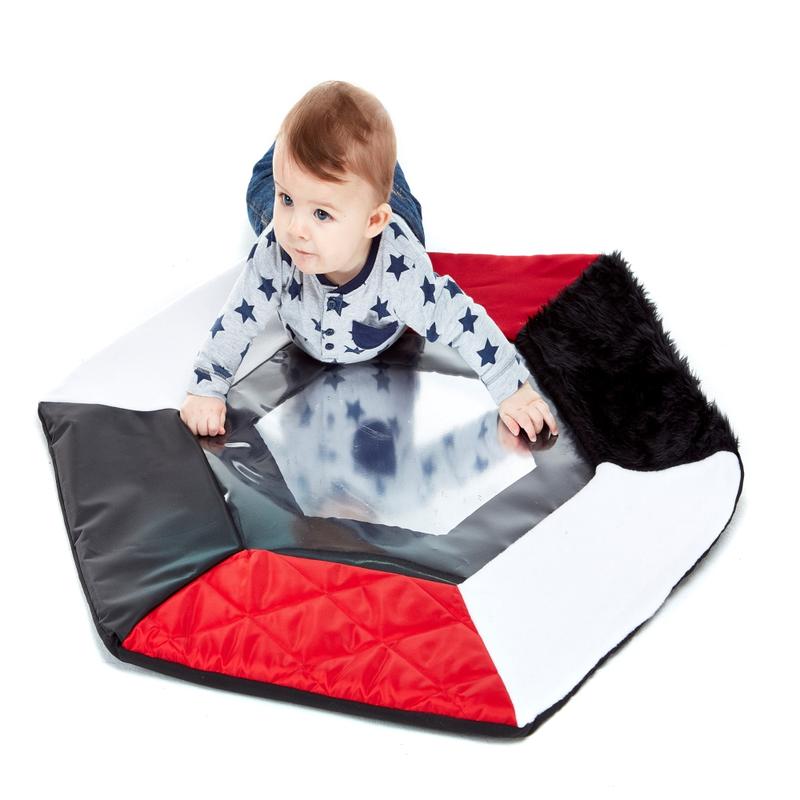 Texture Reflector Mat, The Texture Reflector Mat is a must-have for anyone looking to provide a fun and stimulating environment for children of all ages. This innovative mat features large tactile soft panels that surround an unbreakable plastic mirror, creating a delightful experience for the inquisitive minds.Designed with babies and young children in mind, the Texture Reflector Mat is perfect for them to crawl onto and explore. The soft panels provide a variety of textures for little hands to touch and f