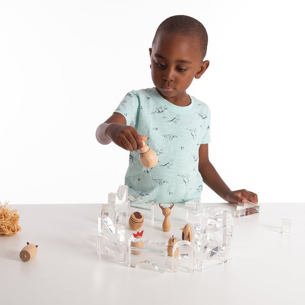 TickiT Clear Crystal Block Set, The TickiT® Clear Crystal Block Set is a magnificent collection of transparent blocks that will ignite your child's creativity and imagination. Designed with safety in mind, the blocks have polished edges, ensuring a smooth and tactile experience for little hands.This 25-piece set includes 17 different shapes, providing endless opportunities for your child to create patterns, sequences, and stunning structures. Let them embark on an imaginative journey and build an ice castle