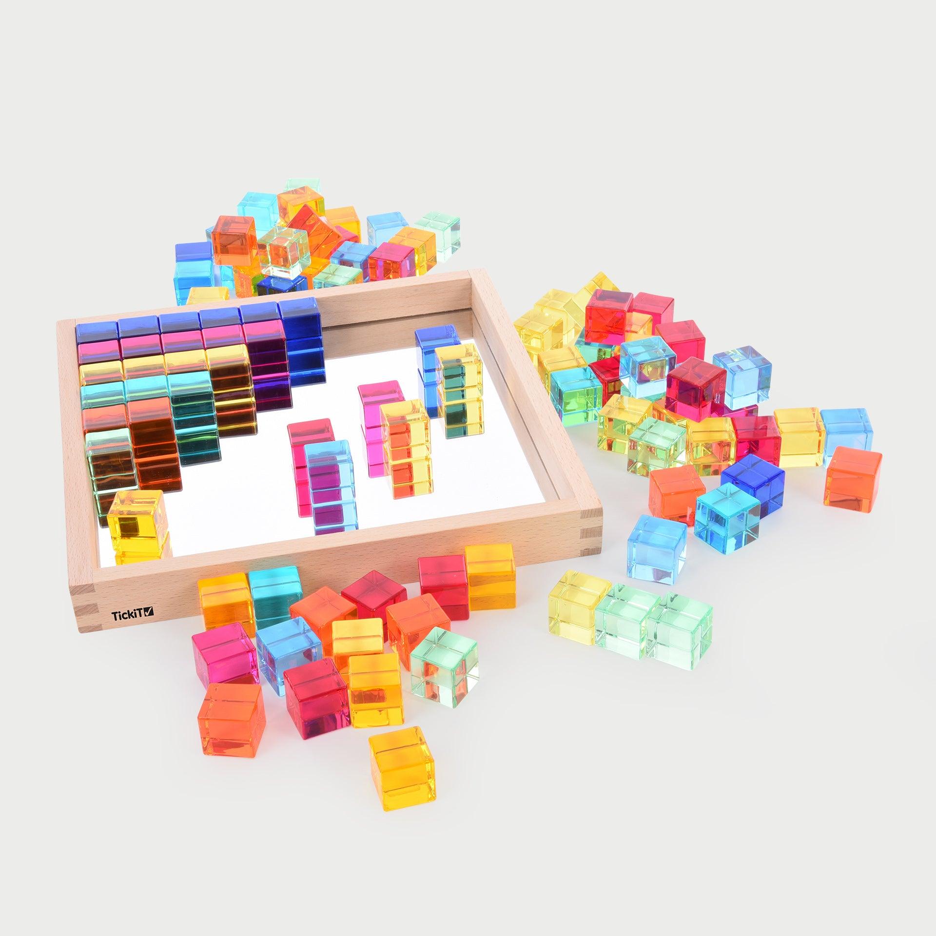 TickiT Gem Cube Mirror Tray, Our TickiT® Gem Cube Mirror Tray is a captivating set of 100 colourful gem cubes in a nicely presented wooden tray. Beautifully finished with tactile smooth edges, the sparkling gem cubes come in 10 bright colours and are ideal for colour sorting, colour mixing, counting and using on a light panel or for colour reflection. Younger children can use them for tower building or pattern making. Older children will find them useful for independent mathematical activities, sequencing a