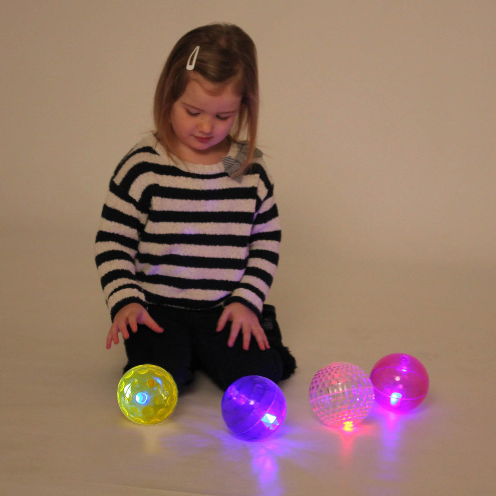 TickiT Large Texture Sensory Flashing Ball Set, The TickiT Large Texture Sensory Flashing Ball Set will fascinate and captivate your child's attention and imagination. When bounced, the balls light up and flash making them great for children to play with in sensory areas or to play throw and catch games with. They are the perfect size for small hands and the different textured surfaces make them interesting and tactile. Good too for use in fun games of throw and catch as they are ideal for a young child’s h