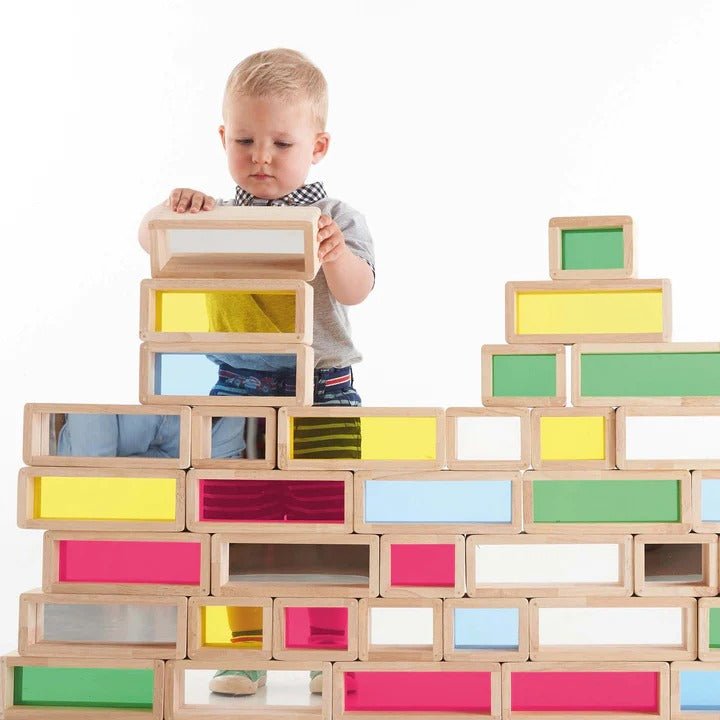 TickiT Rainbow Bricks, TickiT® Rainbow Bricks are giant rubberwood bricks with a beautiful colourful acrylic centres. The transparency of the TickiT Rainbow Bricks allows light to pass through and create a visually stunning effect to captivate your child's imagination. The TickiT Rainbow Bricks can be stacked to create a rainbow wall or half sized bricks can help your child to build an interesting structure. Colourful and tactile, children will love using them to build, see the world in different colours, f