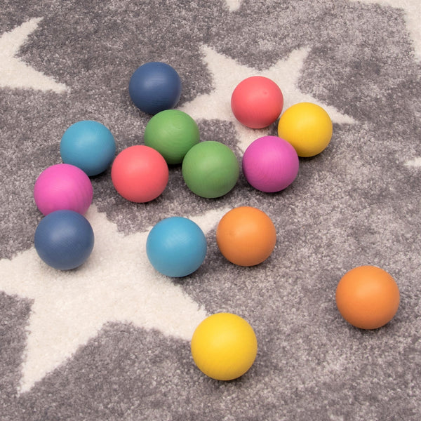 TickIt Rainbow Wooden Balls, Our TickiT Rainbow Wooden Balls are made from beautiful smooth solid beechwood with a natural woodgrain finish in the seven different colours of the rainbow. Ideal for holding, rolling, sorting, counting, colour matching and small world play scenes. The TickIt Rainbow Wooden Balls are perfect for your child to use their imagination during creative play, build on construction skills, improve counting, sorting, stacking and sequencing skills and learn about colour and pattern-maki