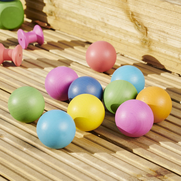 TickIt Rainbow Wooden Balls, Our TickiT Rainbow Wooden Balls are made from beautiful smooth solid beechwood with a natural woodgrain finish in the seven different colours of the rainbow. Ideal for holding, rolling, sorting, counting, colour matching and small world play scenes. The TickIt Rainbow Wooden Balls are perfect for your child to use their imagination during creative play, build on construction skills, improve counting, sorting, stacking and sequencing skills and learn about colour and pattern-maki