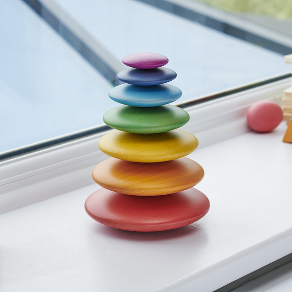 TickiT Rainbow Wooden Buttons, Introducing TickiT® Rainbow Wooden Buttons – the perfect educational toy for your child's playtime adventures. Crafted from exquisite, smooth solid wood, these buttons feature a natural woodgrain finish and come in seven vibrant colors of the rainbow. Your child's creativity will flourish as they use these giant wooden buttons to build fantastic and wobbly stacking towers. With a smooth and tactile surface, these buttons are designed for little hands to explore and enjoy. What