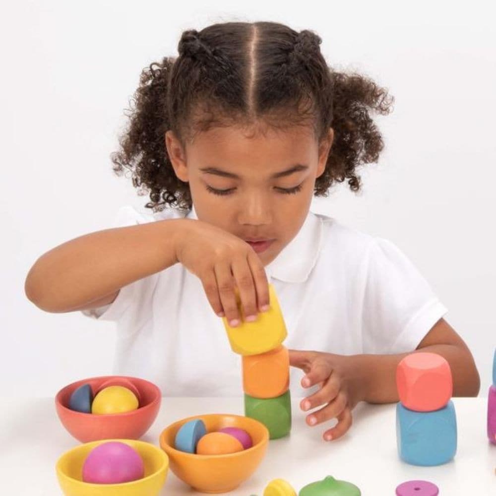 TickIT Rainbow Wooden Cubes Pk14, The TickIT Rainbow Wooden Cubes are beautiful smooth solid beechwood cubes in the seven colours of the rainbow, with a natural finish to show the grain of the wood. The TickIT Rainbow Wooden Cubes are ideal for creating imaginative scenes, encouraging construction skills, counting and sorting, stacking and sequencing, pattern-making and learning about colour. The TickIT Rainbow Wooden Cubes set matches our Rainbow Architect range, but can also be included in any loose parts