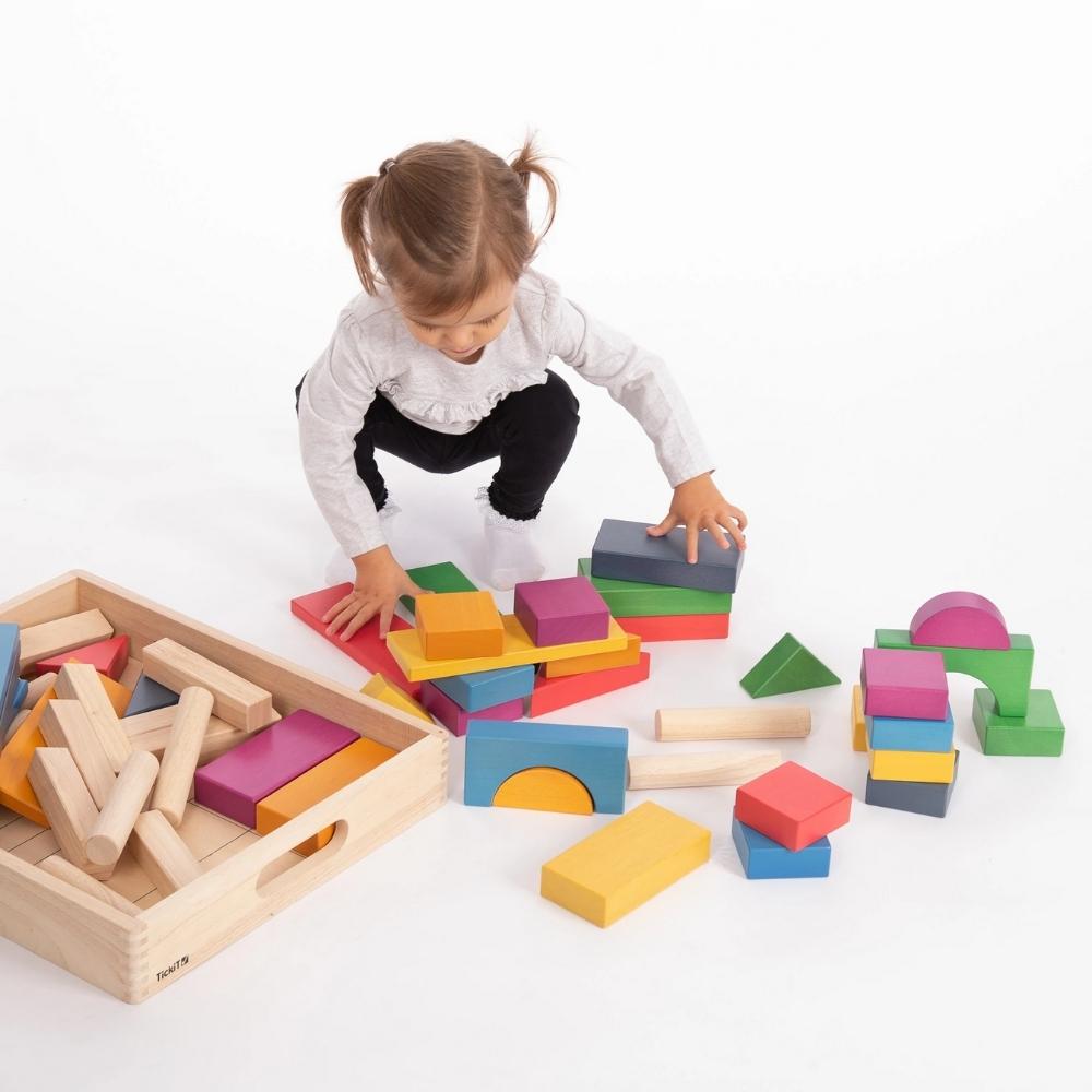 TickiT Rainbow Wooden Jumbo Block Set, Our TickiT® Rainbow Wooden Jumbo Block Set is a beautiful selection of 54 solid wooden blocks in a mixture of natural and attractive rainbow colours. The TickiT Rainbow Wooden Jumbo Block Set are safe and smooth traditional shapes for construction play. The TickiT Rainbow Wooden Jumbo Block Set are the perfect size for small hands to build impressive towers and structures, whilst developing your child's fine motor skills and enabling imaginative play. The TickiT Rainbo
