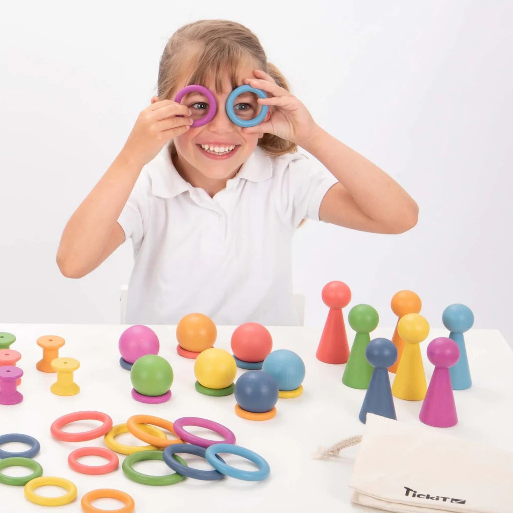 TickIt Rainbow Wooden Rings, Our TickiT® Rainbow Wooden Rings are made from beautiful smooth solid beechwood with a natural woodgrain finish in the seven different colours of the rainbow. The TickIt Rainbow Wooden Rings are Ideal for rolling, threading, sorting and sequencing. For older children why not set a stacking challenge! The TickIt Rainbow Wooden Rings are perfect for your child to use their imagination during creative play, build on construction skills, improve counting, sorting, stacking and seque