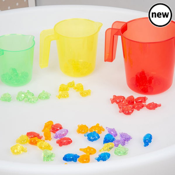 Tickit Translucent Colour Nesting Jugs, Discover the world of learning through play with our tickit® Translucent Colour Nesting Jugs – the ideal companions for your child's sand and water adventures. Designed with little hands in mind, these jugs are easy to hold, featuring a simple pouring lip that adds to the fun of tipping and pouring liquids. The Tickit Translucent Colour Nesting Jugs come as a set of three vibrant colors and sizes, these nesting jugs are not just playtime essentials but also valuable t