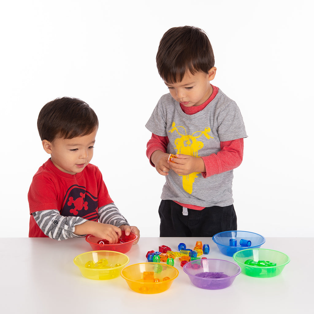 TickiT Translucent Colour Sorting Bowls, These lovely TickiT Translucent Colour Sorting Bowls will provide your child with endless fun as they are the perfect size for little hands to stack and carry around. TickiT® Translucent Colour Sorting Bowls make a handy portable sorting set. Sorting is an important early maths activity: children learn to sort and "classify" objects based on their differences or similarities. They can also start to use and understand the concept of counting as they place items into e