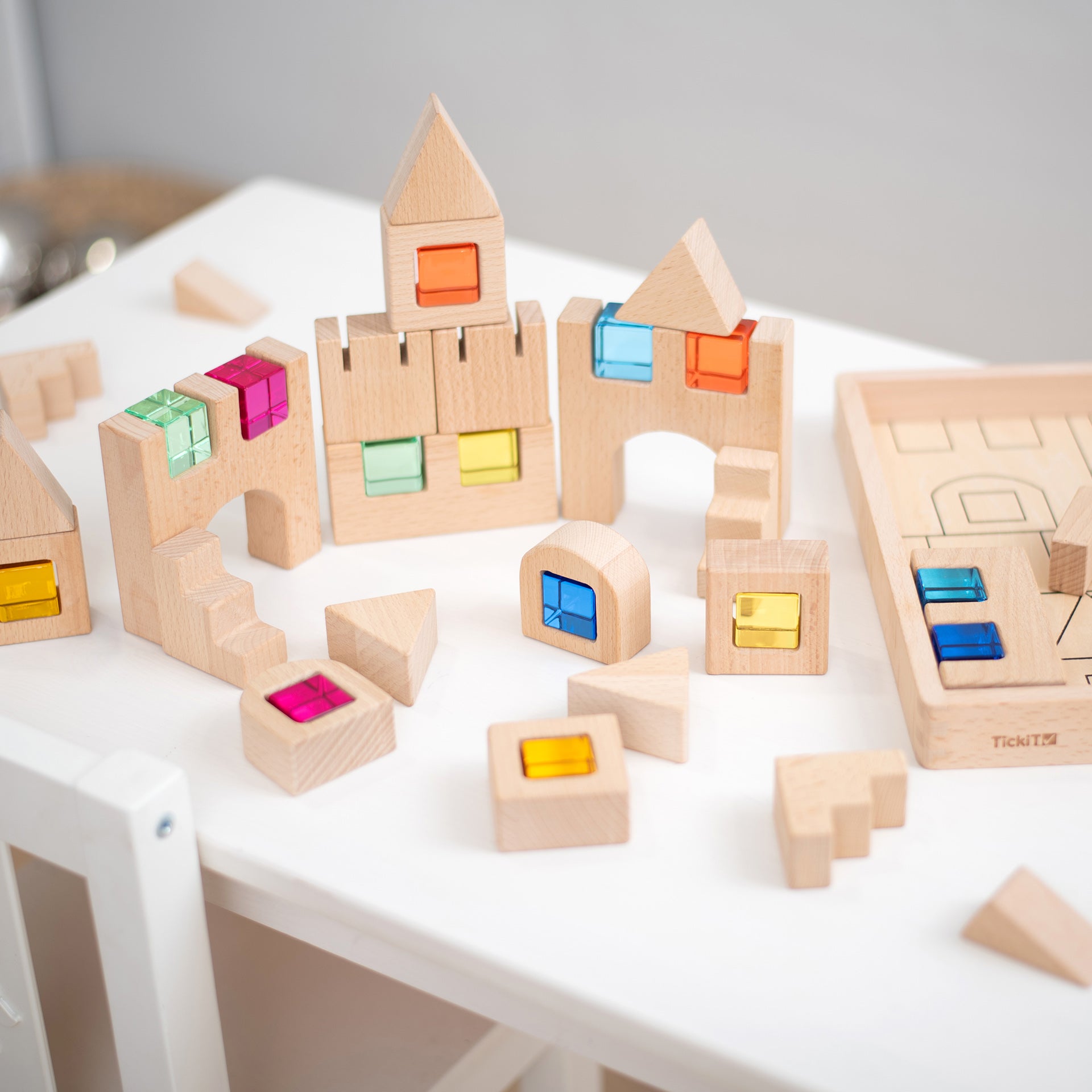 TickiT Wooden Building Gem Blocks, Creatively designed, our TickiT® Wooden Building Gem Blocks will encourage your child to use their limitless imagination, construct exciting structures, and learn through play! The smooth natural wooden blocks with crystal gem cube inserts give bursts of captivating colour, sparking your child's curiosity. The blocks are tactile and offer an open-ended approach for your child to have the freedom to use them however they choose. Older children can use their advanced creativ