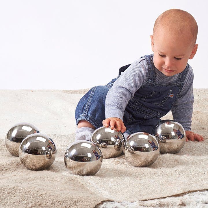 TickiT® Sensory Reflective Mystery Balls, The TickiT® Sensory Reflective Mystery Balls are reflective mirror balls that look identical but all have individual characteristics. Some of the Sensory Reflective Mystery Balls wobble when rolled, or turn and won’t roll in a straight line, some feel funny when twisted, spun or shaken, and others make different shaker or rattle sounds. The shiny mirror surface on the TickiT® Sensory Reflective Mystery Balls provides a distorted fish-eye lens reflection which is fas