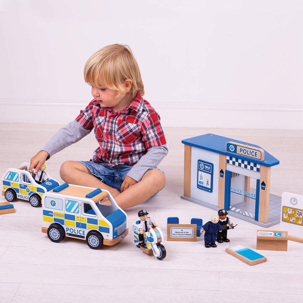 Tidlo Police Car, Get ready for high-speed chases and daring rescues with the Tidlo Police Car. This sturdy wooden Tidlo Police Car is built to last, making it perfect for endless hours of play. Its detailed design is sure to captivate your child's imagination, transforming playtime into an exciting adventure.The Tidlo Police Car comes fully equipped to handle any emergency. With a removable roof panel, your little hero can easily apprehend the baddies and place them in the back of the car, ready to be tran