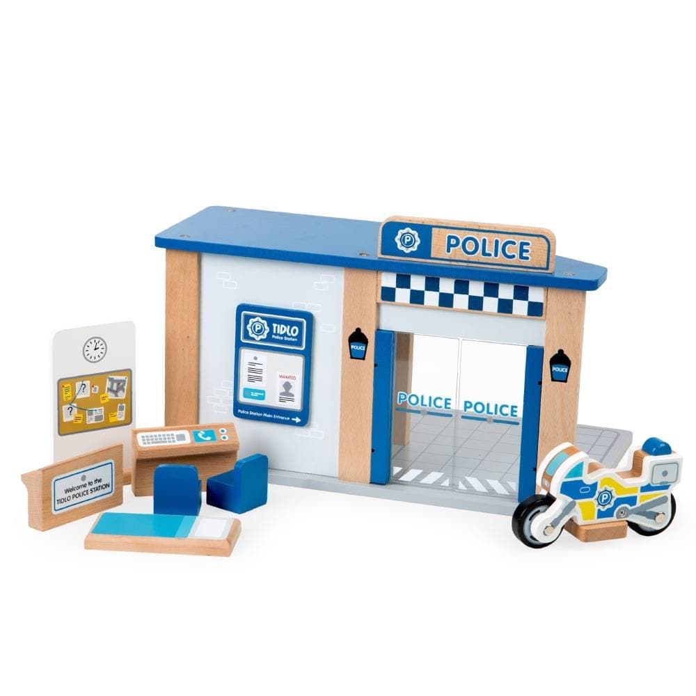 Tidlo Police Station Toy, The Tidlo police have been very busy catching baddies and putting them in jail. Using the suspect board, police have been able to find out who the bad guys are and race around catching them before they get away!This open play wooden Police Station Toy offers endless play scenarios and comes complete with seven accessories, including a reception desk, dispatch desk, 2 chairs, cell beds, a suspect/line-up board and a police bike. Plus, a built-in jail with sliding doors and bar detai