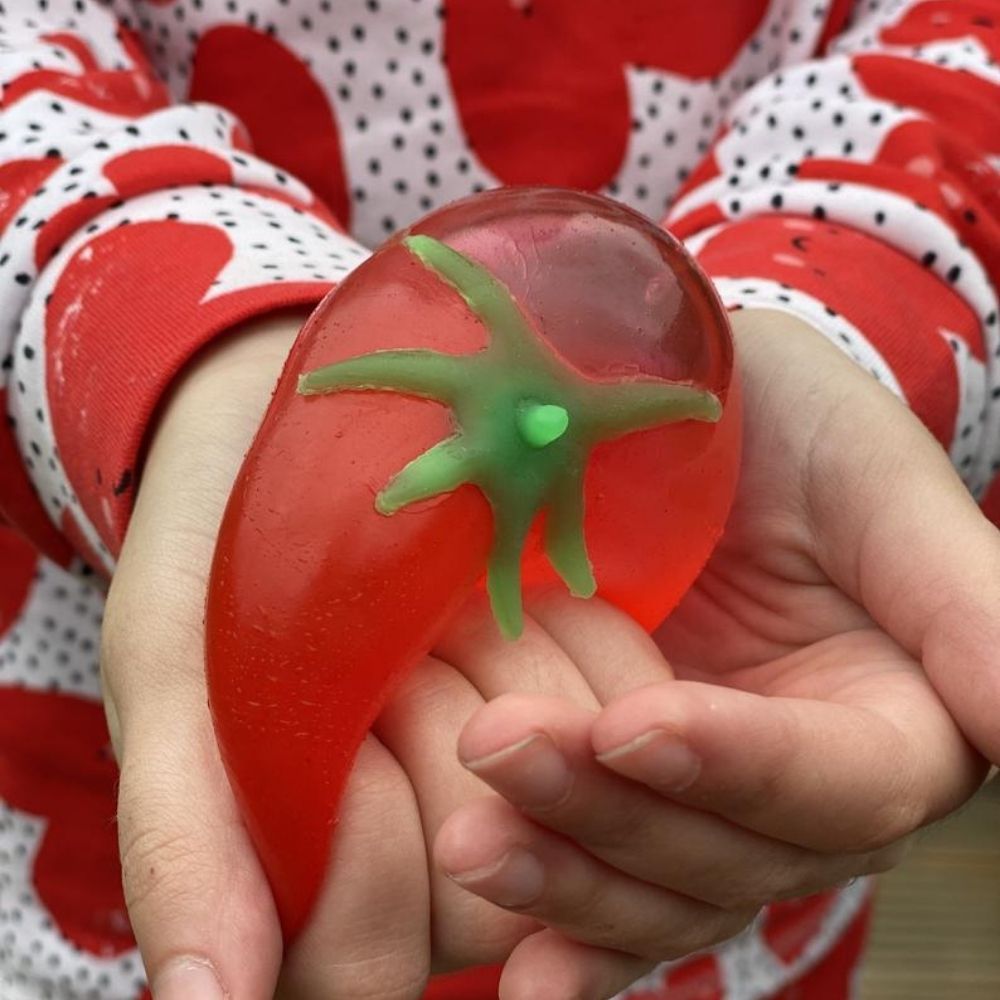 Tomato Splat Ball, Why not have a food fight without the mess? These Tomato Splat Balls are filled with water are great and fun learning activity for children of all ages. It's a squishy toy that's quite unlike anything else in our collection, as the Tomato Splat Ball provides an interesting tactile experience when squeezed,and to add to the fun you can throw it against a window or hard surface and it will splat, and then return to its normal shape. Strengthens hand’s intrinsic muscles and fine motor skills