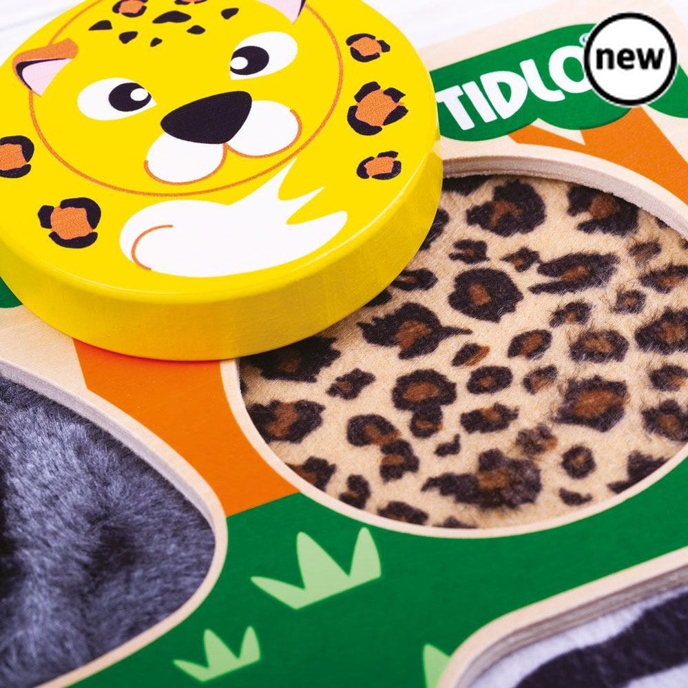 Touch and Feel Safari, Feel the hairy gorilla and the furry lion... These are just two of the exciting textures to explore on this delightful Touch and Feel Safari Puzzle. The safari animals that are illustrated in this colourful jungle scene are a gorilla, lion, leopard and zebra. The Tidlo Touch and Feel Puzzles are a diverse range of sensory puzzle boards great for early development. Remove the four wooden puzzle pieces to reveal different, appropriately textured materials underneath the animals. A great