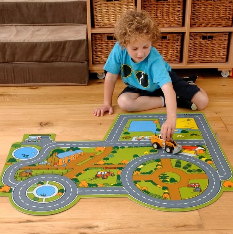 Tractor Farm Playmat, The Tractor Farm Play mat is designed for very young children. this mat is car shaped. Both roads and railways are illustrated using clear colourful design. The Tractor Farm Play Mat Play is printed on 100% polyester surface with a rubber anti-slip backing. Dimensions: 1000 x 860mm Large brightly coloured play mat will be a great addition for any youngster Simply packed with brilliant detail - they'll play happily for hours! A superb base for adding favourite farm animals, buildings, t
