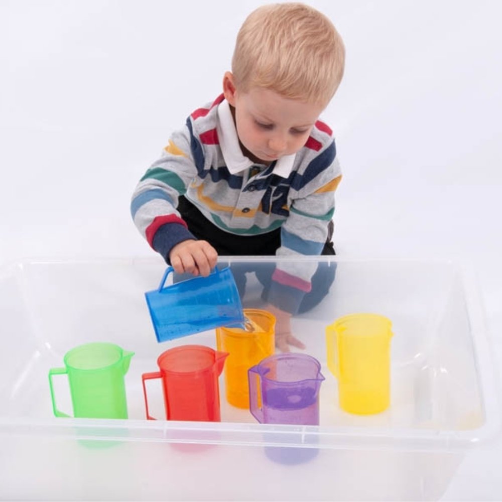 Translucent Colour Jug Set Set of 6, Discover a World of Learning and Fun with Our TickiT® Translucent Colour Jug Set!Introduce your child to the fascinating world of colours, measurements, and tactile experiences with our TickiT® Translucent Colour Jug Set. Perfectly sized for little hands and big imaginations, this set offers a rainbow of opportunities for educational play. TickiT® Translucent Colour Jug Set Features: Ideal Size for Little Hands These TickiT® Translucent Colour Jugs are designed to fit co