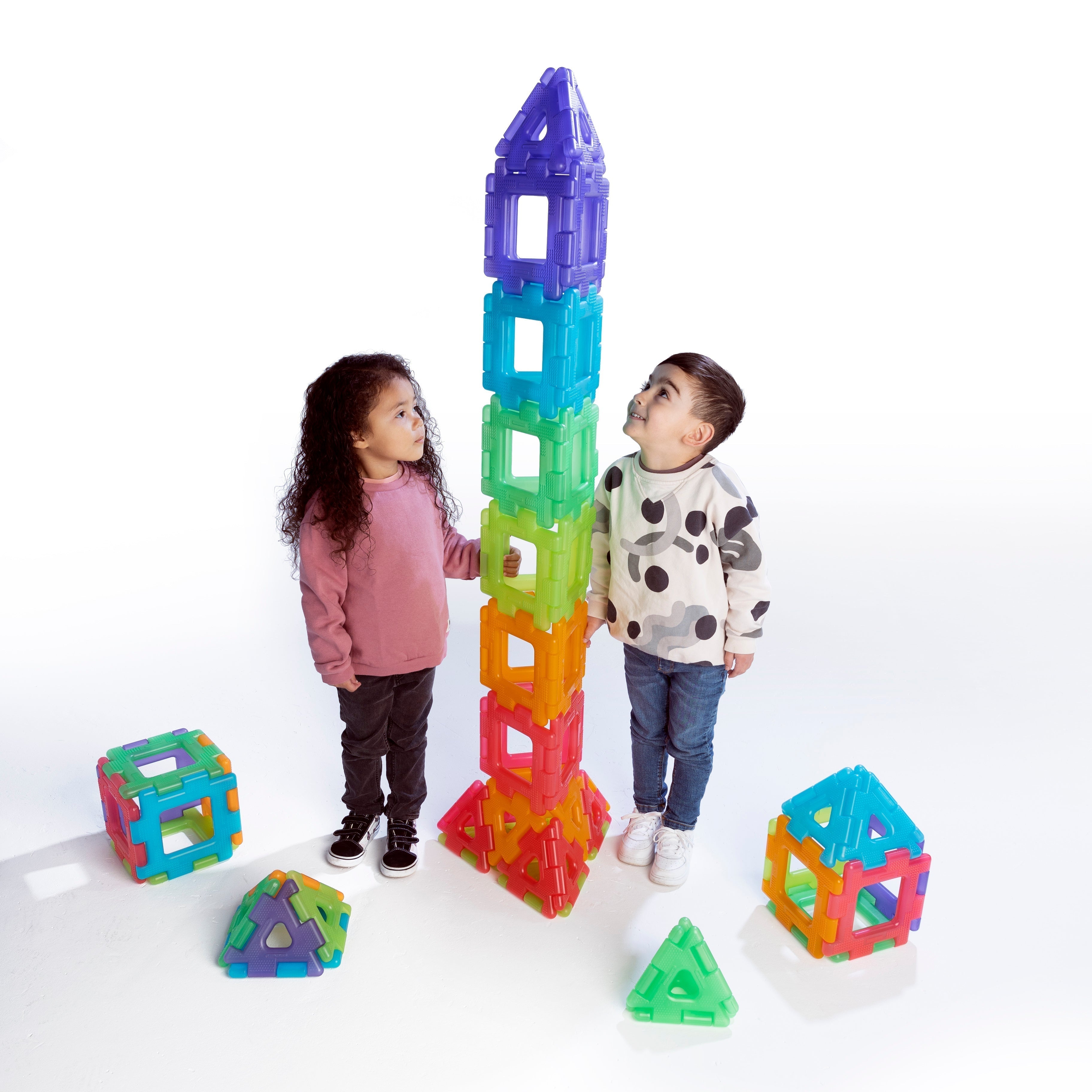 Translucent Giant Polydron Set-60 Pieces, Create colourful constructions with Translucent Giant Polydron! This 60-piece set contains equal numbers of squares and triangles in 6 stunning colours. The Translucent colours add a whole new dimension to play when using the pieces outdoors in natural sunlight or with a light source. Improve fine and gross motor skills through construction play. The Translucent Giant Polydron Set-60 Pieces set is suitable for both indoor and outdoor use. The large, chunky pieces ar