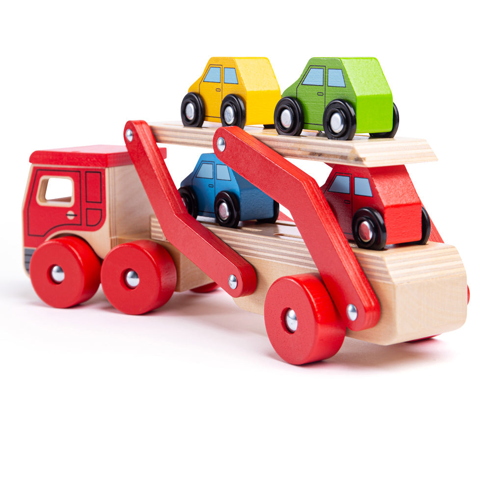 Transporter Lorry, This wooden Transporter Lorry Toy helps to develop kids’ dexterity and coordination as they play. It carries a load of four colourful wooden cars (which slot nicely onto the trailer) and is safe for little hands to play with. The toy car transporter lorry’s upper deck can be easily lowered to allow each vehicle to drive on and off and grooves in the surface help to keep each car in place as they're transported to their destination. It is made from high-quality, responsibly sourced materia