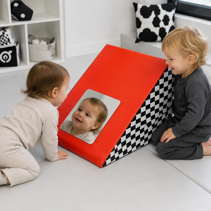 Triangle Mirror Wedge shared reflection play in a monochrome sensory corner