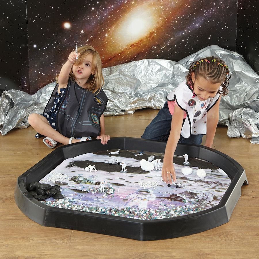Tuff Tray Insert Space Station Alpha, Introducing the Space Station Alpha Tuff tray mat, a captivating addition to the Active World experience! This exquisitely illustrated mat will transport your little ones on an incredible intergalactic adventure. With this mat, they can embark on a rocket journey to the moon, moonwalk alongside awe-inspiring astronauts, and embark on an expedition to explore the lunar craters. The possibilities for imaginative play are endless as they can even hop onto moon buggies and 