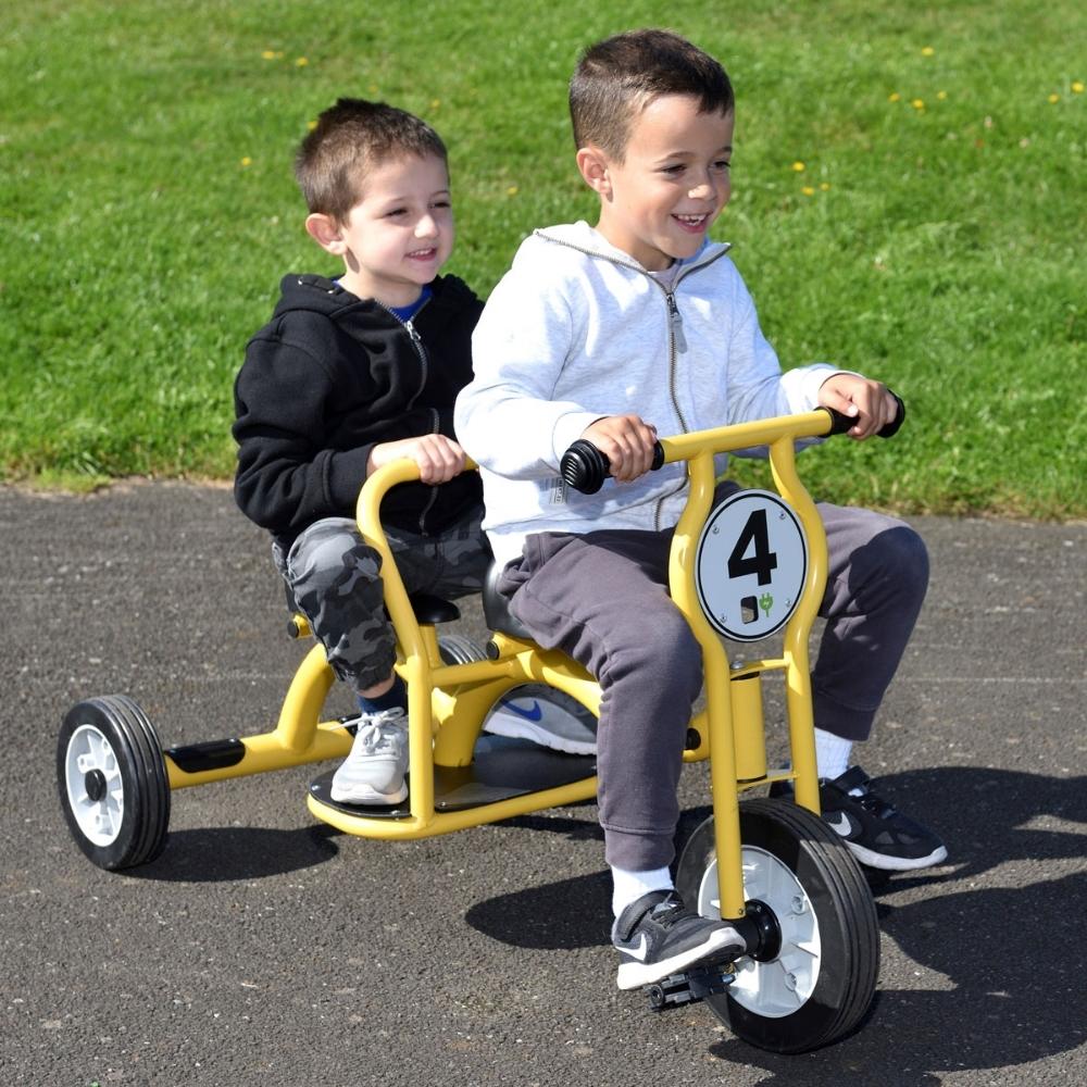 Wisdom Tandem Trike, The Wisdom Tandem Trike encourages shared play amongst children aged 4-8 years with this 2 seat Wisdom tandem trike. With the Wisdom Tandem Trike it has recognised durability and stability, children can take turns being the driver or the back seat driver with a stability bar to hold onto and a foot rest.The Wisdom Tandem Trike has wheels which are made of durable polypropylene with solid rubber puncture proof tyres.The Wisdom Tandem Trike is designed for children aged 4-8 years old. Tyr