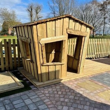 Woodcutters Cottage, The Woodcutters Cottage is an inviting characterful playhouse guaranteed to add interest and intrigue to any outdoor space. The Woodcutters Cottage is perfect for role play, outdoor teaching and works as a great reading hide. The cottage is spacious enough to fit a small group of children to help aid their early years' education. A unique product made from FSC Pressure Treated Redwood Timber, children will love playing inside this playhouse. Delivery 3-4 weeks FSC Pressure Treated Redwo