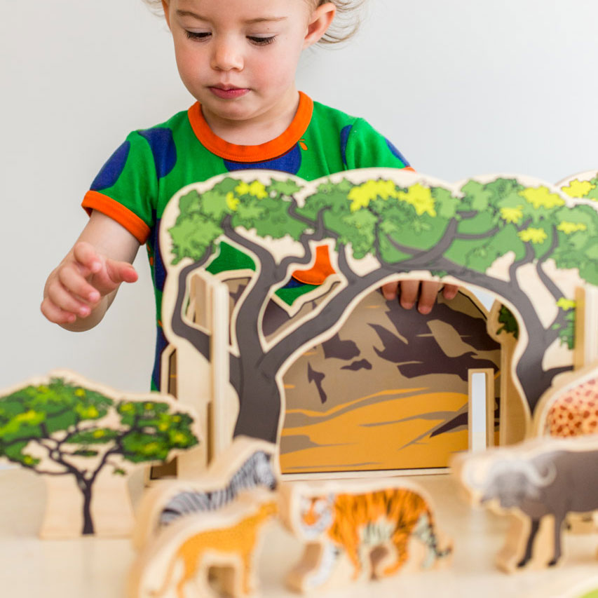 Wooden Animals In The Wild, The Wooden Animal Set is a top-quality product designed for children to foster their creativity and imagination. The set includes a range of beautifully illustrated wild animals, two wooden arched trees, a mountain range, and a wooden tree. The set is perfect for creating an exciting playscape for your little ones to explore.The wooden animals featured in the set include 12 of the most popular wild animals such as tigers, lions, zebras, monkeys, crocodiles, giraffes, gazelles, bu