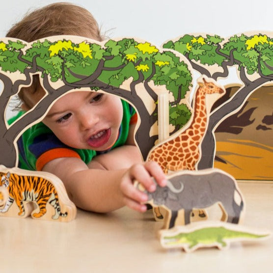 Wooden Animals In The Wild, The Wooden Animal Set is a top-quality product designed for children to foster their creativity and imagination. The set includes a range of beautifully illustrated wild animals, two wooden arched trees, a mountain range, and a wooden tree. The set is perfect for creating an exciting playscape for your little ones to explore.The wooden animals featured in the set include 12 of the most popular wild animals such as tigers, lions, zebras, monkeys, crocodiles, giraffes, gazelles, bu