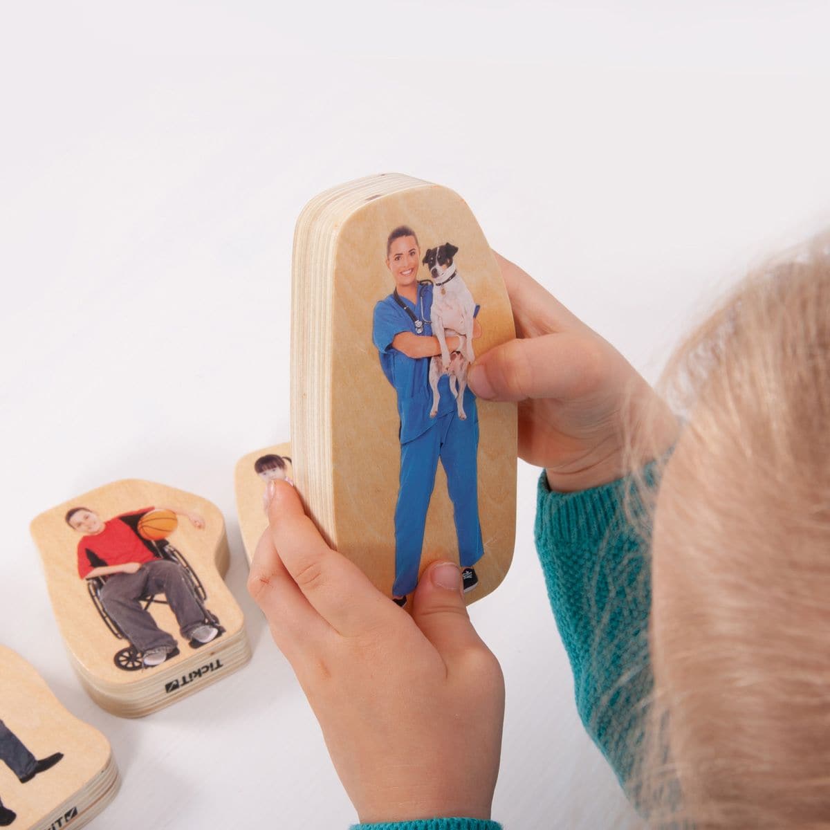 Wooden Community People Blocks, The Wooden Community People Blocks are made up of chunky wooden blocks with colour printed on both sides with real images of people from a range of communities, perfect for young children to engage in imaginative play and develop their descriptive language skills. The 20mm birch Wooden Community People Blocks are smooth to touch and easy for small children to handle. Having realistic images will enable younger children to recognise and relate to the characteristics of other p