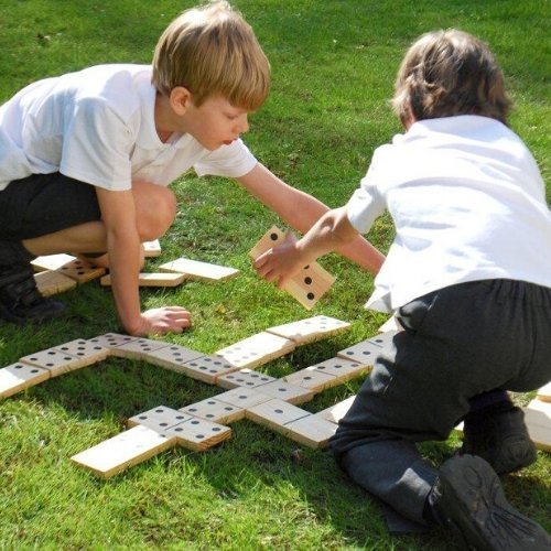 Wooden Dominoes, Elevate your traditional game nights with TickiT® Wooden Dominoes, a classic yet innovative set designed for endless fun and educational enrichment. Made from solid pine, these dominoes are not just for laying down in a line; they're a tool for developing mathematical skills, all while ensuring durability and safety for younger players. TickiT® Wooden Dominoes Features: Quality Materials: Each piece is made from solid pine wood, promising long-lasting durability and suitability for outdoor 