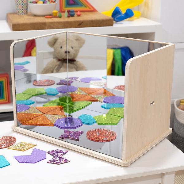 Wooden Exploratory Mirror, Our new Wooden Exploratory Mirror has parallel sides to reflect images backwards and forward to infinity, ideal for children to use in imaginative play, to create small world environments, for learning about reflection and mirror effects, or to closely inspect interesting objects. The solid construction of the Wooden Exploratory Mirror provides a stable base for the 2mm acrylic mirrors, making the image flatter and clearer. The Wooden Exploratory Mirror comes with a clear acrylic 