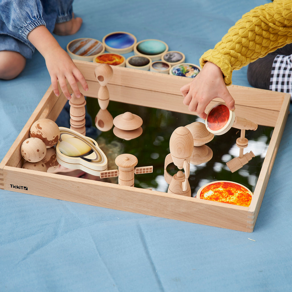 Wooden Mirror Tray, Welcome to the enchanting world of the TickiT® Wooden Mirror Tray, where your child can delve into the mysteries of reflection and discover the magic of small world scenes! This isn't just any tray; it’s a realm of exploration and fascination, merging play and learning in a shiny, reflective adventure! 🌈 Explorative & Educational: This solid beechwood tray, equipped with a 2mm acrylic mirrored base, offers a robust and safe platform for children to play with intriguing objects, exploring