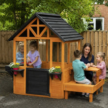 Wooden Playhouse with Table, Benches and Sink – Natural lifestyle play scene 1