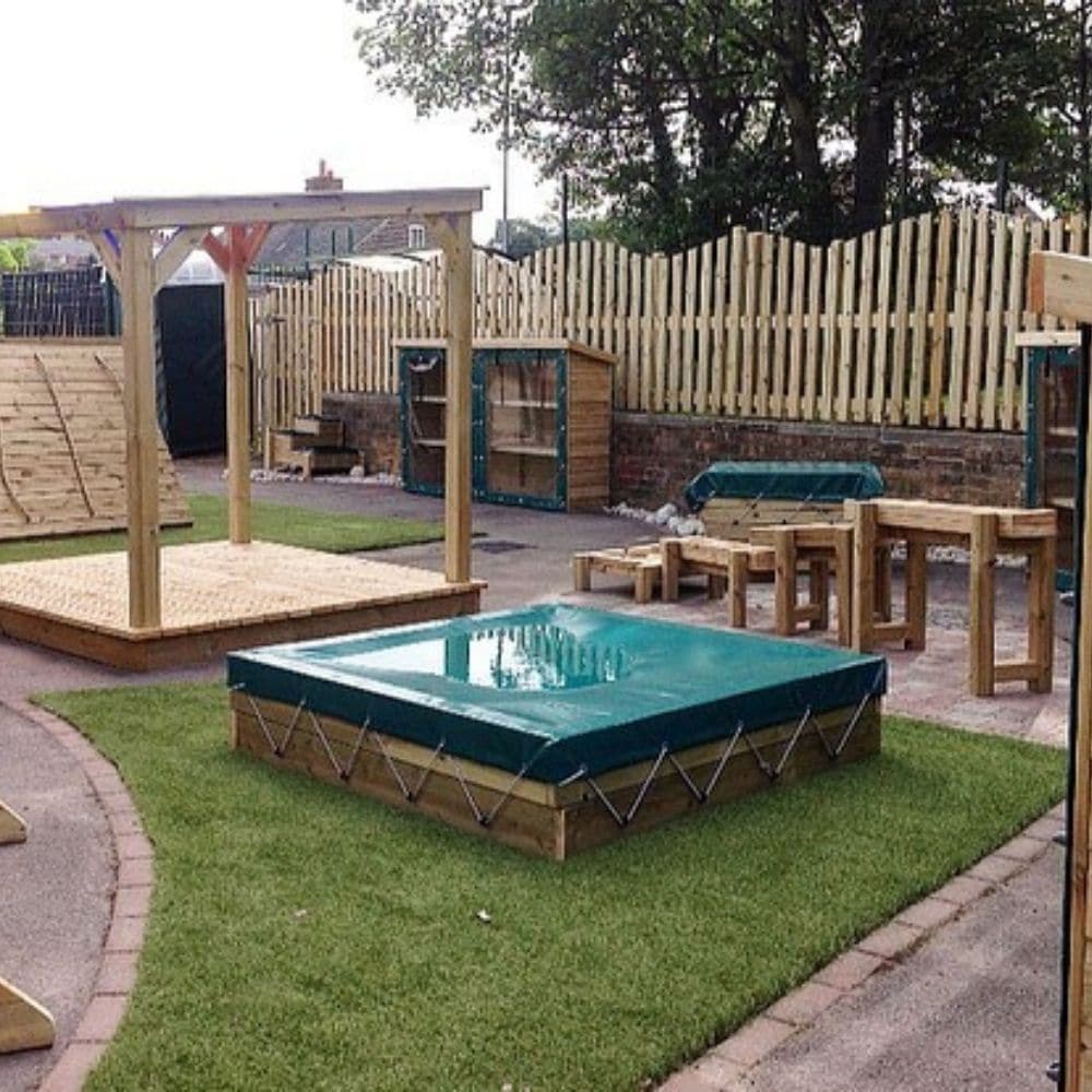 Wooden Sandpit with PVC Cover, This outdoor wooden sandpit is a great addition for any school playground, nursery or garden. Children can dig, build and sieve the sand to learn values of textures and weights and measures.The Wooden Sandpit with PVC Cover is an age-old resource, the sandpit is a great place for children to develop social skills and interaction too. Made from FSC Pressure Treated Redwood Timber. (Sand not included) Delivery 3-4 weeks Delivered fully assembled FSC Pressure Treated Redwood Timb