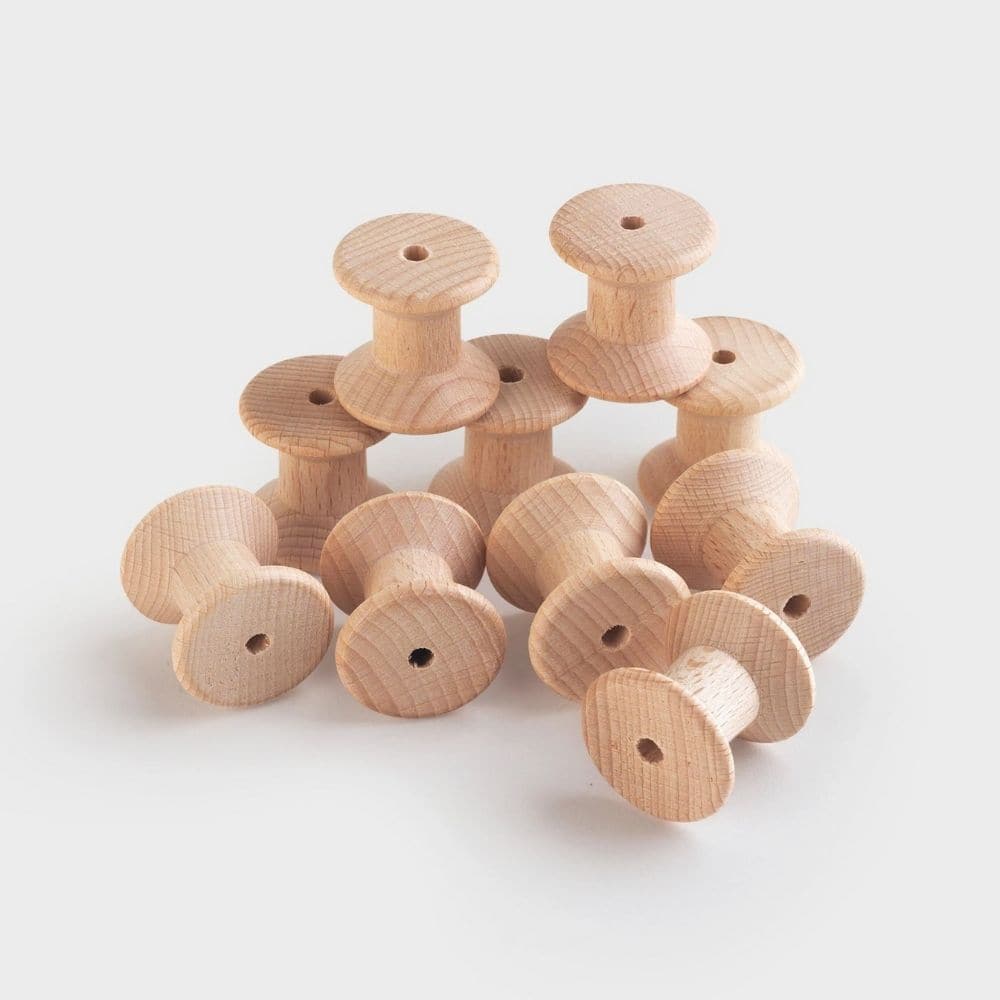 Wooden Spool Set 10pk, Designed to open up a new world of discovery and play, this Wooden Spool Pack of 10 is ideal for igniting the imagination in toddlers. Designed for heuristic play which is rooted in children's natural curiosity, these simple wooden spools create a treasure trove of play ideas that help to develop their playing and cognitive skills. Allow children to feel, pair and stack these beechwood objects again and again and you'll help to develop an open environment where the world of play merge
