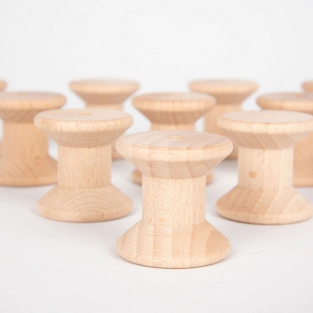 Wooden Spool Set 10pk, Designed to open up a new world of discovery and play, this Wooden Spool Pack of 10 is ideal for igniting the imagination in toddlers. Designed for heuristic play which is rooted in children's natural curiosity, these simple wooden spools create a treasure trove of play ideas that help to develop their playing and cognitive skills. Allow children to feel, pair and stack these beechwood objects again and again and you'll help to develop an open environment where the world of play merge